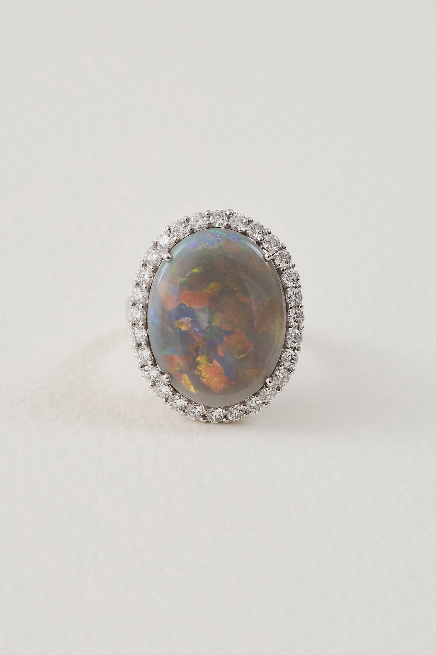 solid opal ring with diamond halo - lightning ridge opals