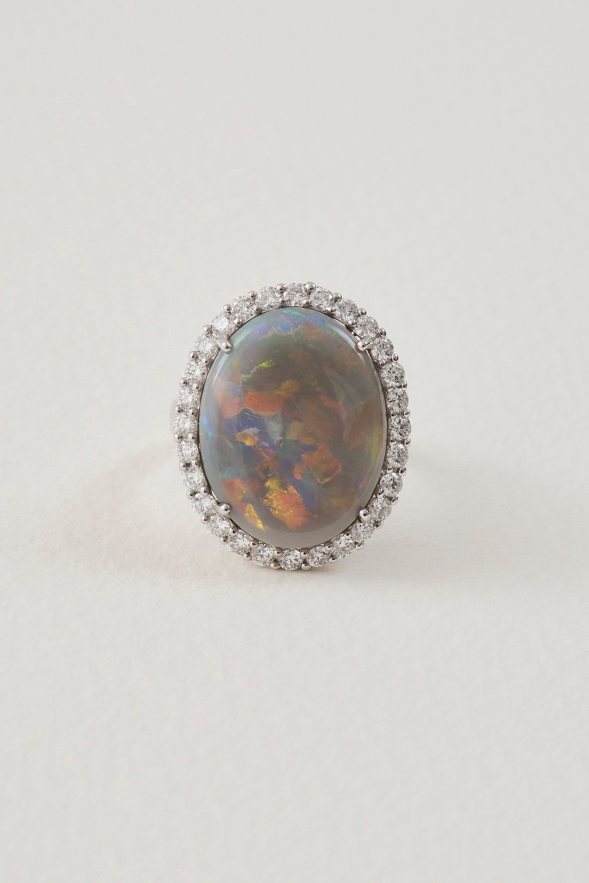 solid opal ring with diamond halo - lightning ridge opals