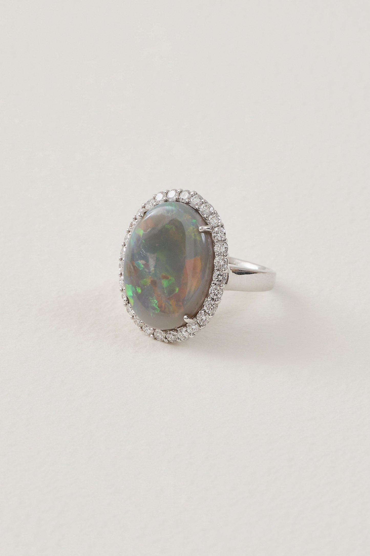 solid opal ring with diamond halo - lightning ridge opals