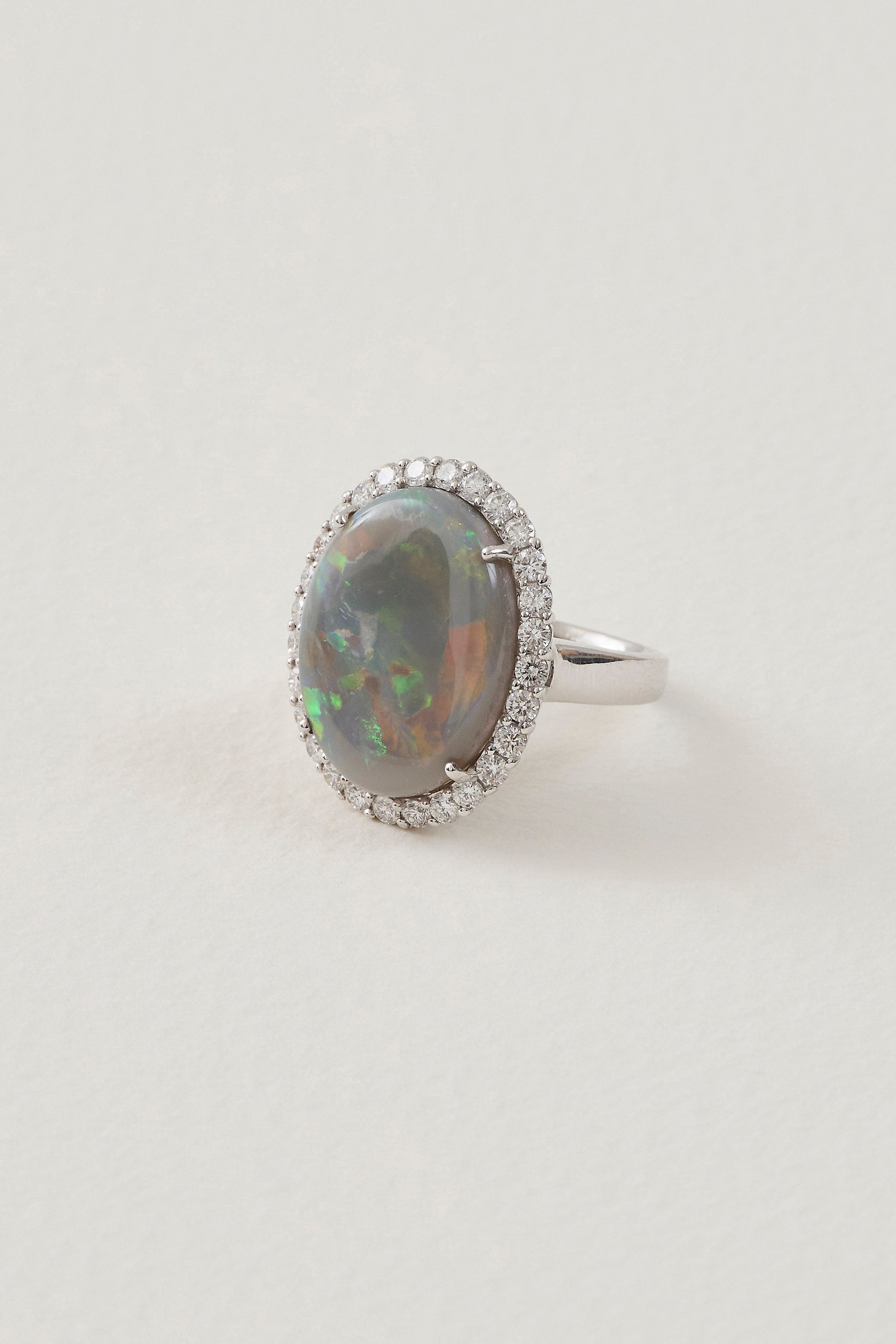 solid opal ring with diamond halo - lightning ridge opals