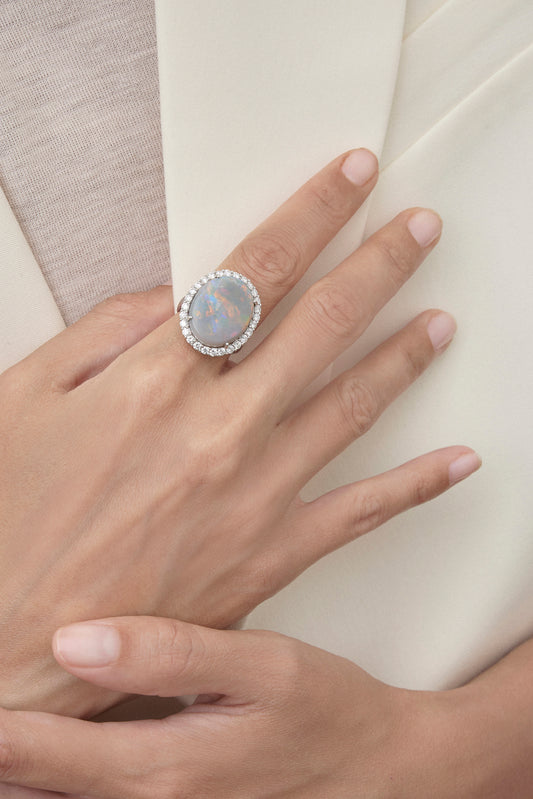 Solid opal ring with diamond halo