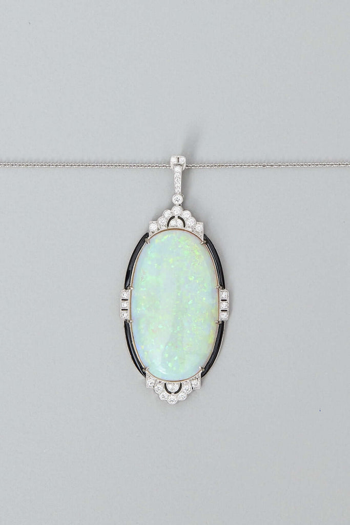 solid opal and diamond pendant in 18ct white gold opal is from lightning ridge available at keshett