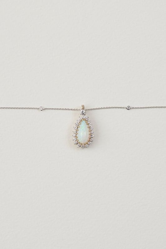 solid opal necklace surrounded by diamonds from lighing ridge available at keshett