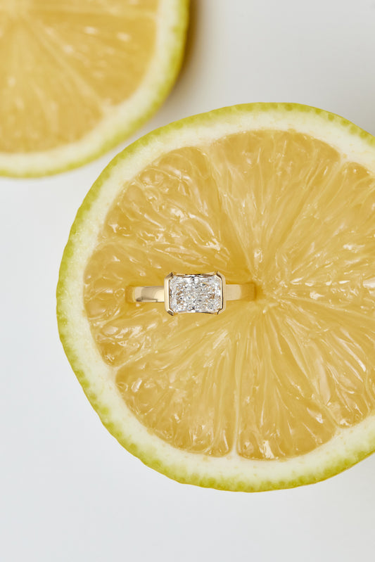 Radiant Half Bezel East-West Ring